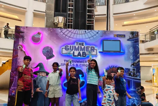 Children lined up on stage in front of the Summer Lab set